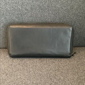 Tumi - Black Leather Continental Wallet with Zip-Around Closure